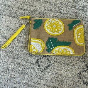 Francesca's Jute woven clutch with green yellow and white beaded detail
